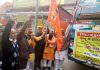 MLA Sham Sharma and Pawan Shastri flagging off bus to Haridwar from Jammu on Friday.