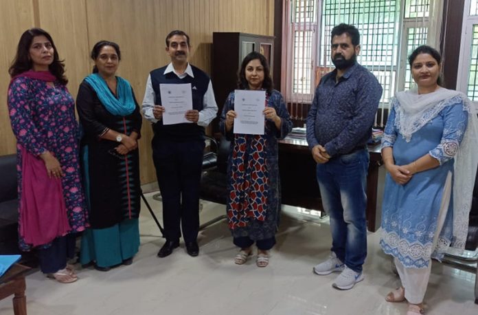 Principal of GDC Nagrota and Principal of Food Craft Institute Jammu displaying copies of MoU signed between two institutes. Principal of GDC Nagrota and Principal of Food Craft Institute Jammu displaying copies of MoU signed between two institutes.