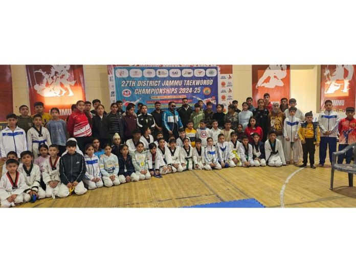 Dignitaries posing along with Taekwondo players during opening ceremony at Jammu.