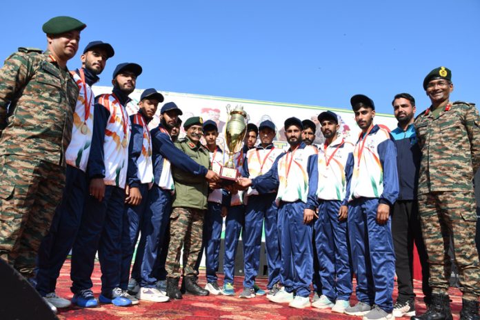 Army officers presenting the trophy to winning team at Mendhar. -Excelsior/Imran Army officers presenting the trophy to winning team at Mendhar. -Excelsior/Imran
