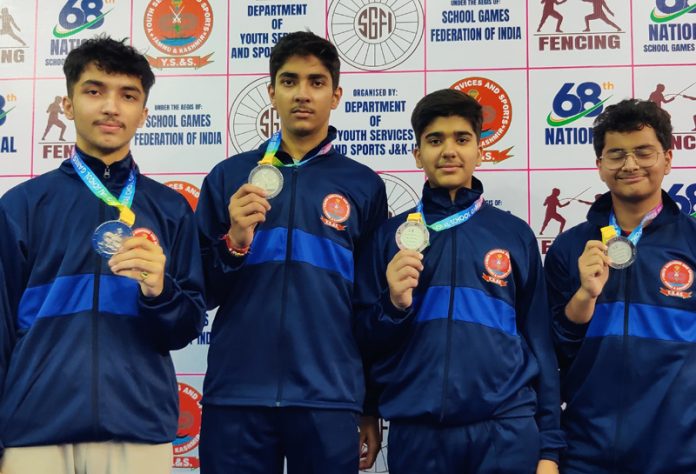 J&K fencers posing along with silver medals.