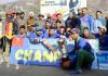 Winning team posing along with trophy and dignitaries at Ramban on Monday.