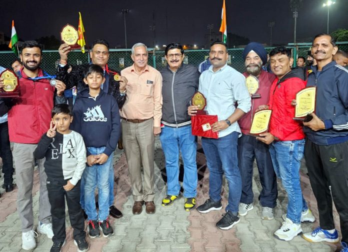 Participants posing along with trophies during prize distribution ceremony at Jammu.