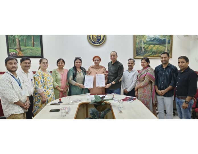Management of MIER and Composite Regional Centre posing along with documents of MoU. Management of MIER and Composite Regional Centre posing along with documents of MoU.