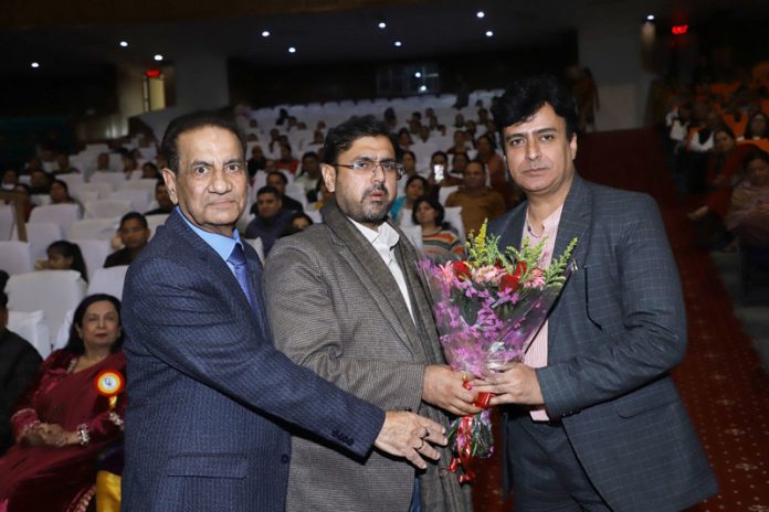 Satish Sharma, Minister for Youth Services and Sports receiving bouquet from school management.