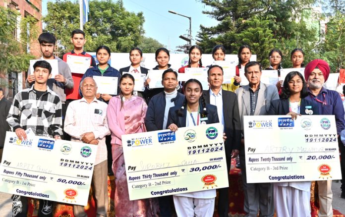 Dignitaries from NHPC and students who participated in painting competition organised in Jammu on Tuesday. Dignitaries from NHPC and students who participated in painting competition organised in Jammu on Tuesday.