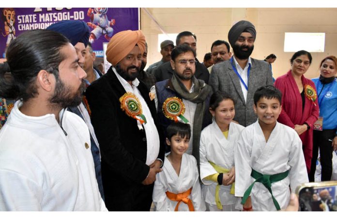 YS&S Satish Sharma posing along with athletes, dignitaries during 21st UT Matsogi-do Championship event at Jammu.