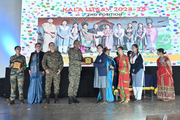 Army officer presenting a souvenir to a student during the Annual Day celebrations at Army Public School Rakhmuthi. Army officer presenting a souvenir to a student during the Annual Day celebrations at Army Public School Rakhmuthi.