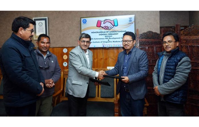 Dr. Zabeer Ahmed, Director CSIR-IIIM and Stanzin Chosphel, EC (Agriculture) at signing of MoU in Leh on Tuesday. Dr. Zabeer Ahmed, Director CSIR-IIIM and Stanzin Chosphel, EC (Agriculture) at signing of MoU in Leh on Tuesday.