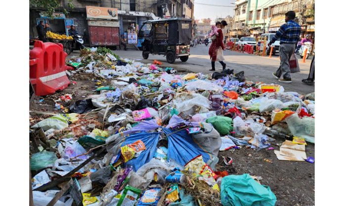 Garbage on Jammu roads as Civic Safai Karamcharis of JMC staged 'Kaam Choro Hartal' protest on Wednesday. -Excelsior/Rakesh