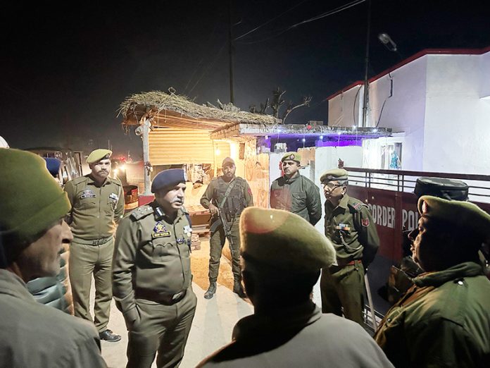 DIG JSK Range interacting with police officials outside a border police post in Jammu district on Tuesday.