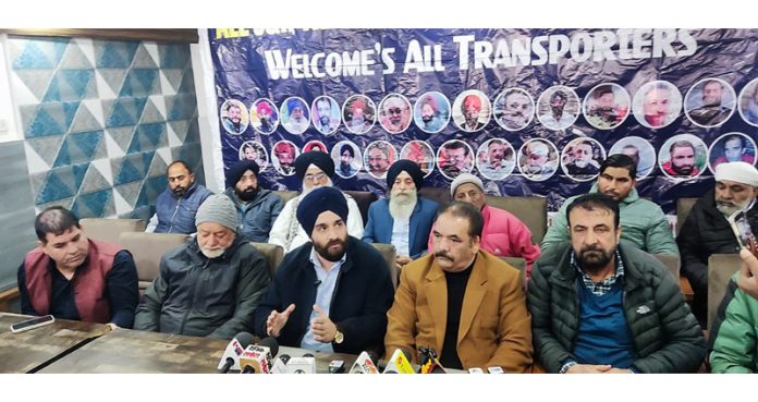 AJKTWA chairman Karan Singh Wazir flanked by Association members from Kashmir and Jammu at a press conference in Srinagar. AJKTWA chairman Karan Singh Wazir flanked by Association members from Kashmir and Jammu at a press conference in Srinagar.