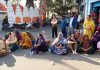People staging protest over mysterious death of a woman, at Paloura Chowk, Jammu.