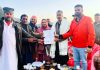 MLA Budhal, Javed Iqbal Choudhary receiving memorandum from locals at Rajnagar village on Sunday.