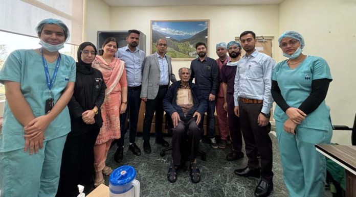 A team of doctors posing with a patient on whom they performed combined CABG and CEA surgery at Narayana Hospital, Katra.