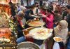 A huge rush of devotees having Prasad during annual Bhandara at ancient Bhairav Temple located at Chowk Chabutra, Jammu. -Excelsior/Rakesh