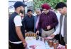 Director Agriculture inspecting stall during Honey Festival.