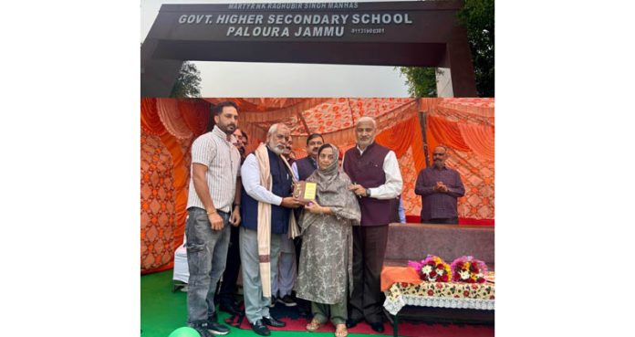MLA Sham Lal Sharma and ex MP S S Manhas honouring the wife of martyr, Raghubir Singh Manhas at a function in Paloura on Thursday. MLA Sham Lal Sharma and ex MP S S Manhas honouring the wife of martyr, Raghubir Singh Manhas at a function in Paloura on Thursday.