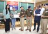 ADGP Jammu Anand Jain presenting a participant with a certificate during a hackathon event organised in Jammu on Thursday.