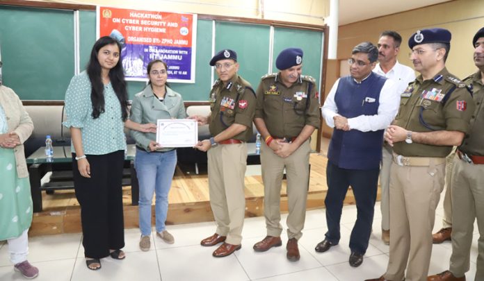 ADGP Jammu Anand Jain presenting a participant with a certificate during a hackathon event organised in Jammu on Thursday. ADGP Jammu Anand Jain presenting a participant with a certificate during a hackathon event organised in Jammu on Thursday.