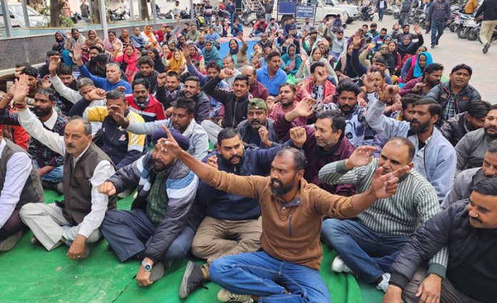 Civic Safai Karamcharis of JMC raising slogans during a protest demonstration in Jammu on Tuesday. — Excelsior/Rakesh