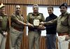 Police officers at PTTI Vijaypur greeting renowned life coach Deepak Manchanda with a memento on Monday.