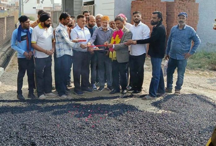 Dr Bharat Bhushan, MLA inaugurating black topping of a street in Kathua on Wednesday.