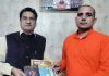 Balbir Ram Rattan, national general secretary, Guru Ravi Dass Vishwa Mahapeeth being presented books by Swami Suchidanand at Jammu on Friday.
