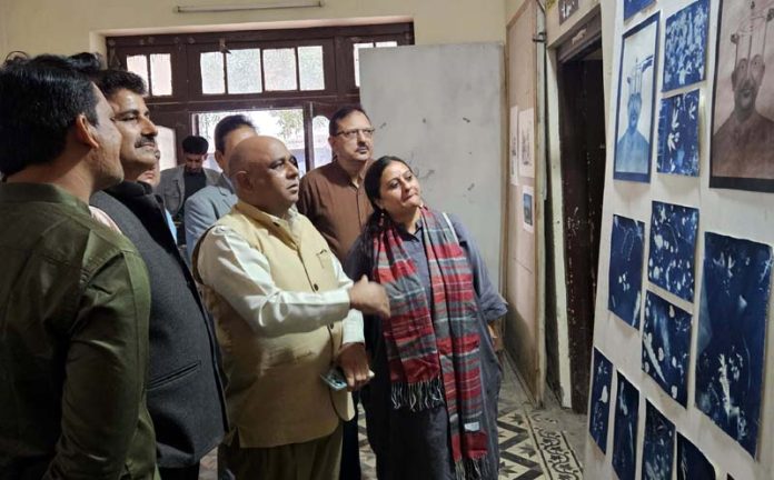 Principal Secretary Culture, Suresh Kumar Gupta along with organizers during an exhibition of artworks in Jammu.