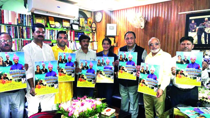 Sohail Kazmi along with others releasing Dogri song album in Jammu on Saturday.