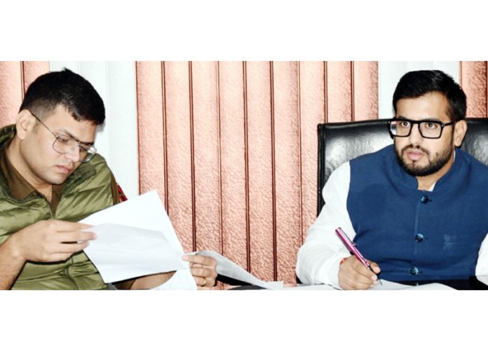 DC Rajouri Abhishek Sharma chairing a meeting on Friday.