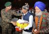General-Officer-Commanding White Knight Corps Lieutenant General Navin Sachdeva interacting with Army Veterans on Poonch Day on Friday. (UNI)