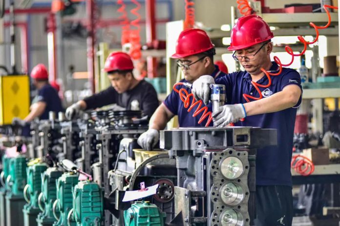 China's manufacturing activity slows  in December as trade risks grow