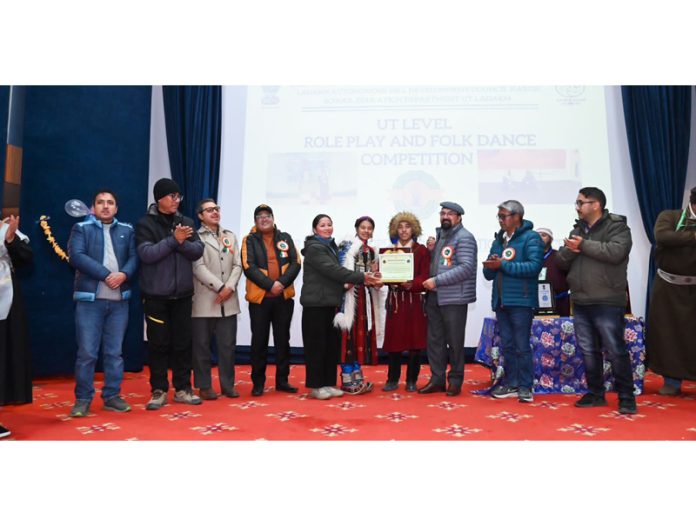 CEC Dr. Mohd Jaffer Akhoon felicitating the students participated in folk dance competition held in Kargil on Monday. CEC Dr. Mohd Jaffer Akhoon felicitating the students participated in folk dance competition held in Kargil on Monday.