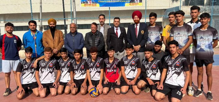 Players along with others pose for a group photograph at the start of 36th Jammu District Volleyball Championship for Boys and Girls in Jammu.