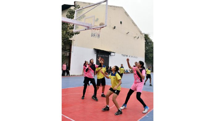 Basketball players in action during a match at MA Stadium Jammu. Basketball players in action during a match at MA Stadium Jammu.