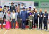 Dignitaries posing for a photograph with the medal-winning players at the Tau Devi Lal Stadium, Panchkula, Haryana.
