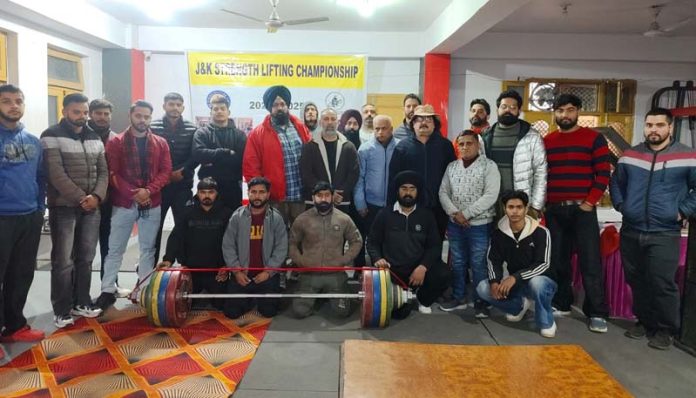 Weightlifters posing along with dignitaries during prize distribution ceremony at Samba.