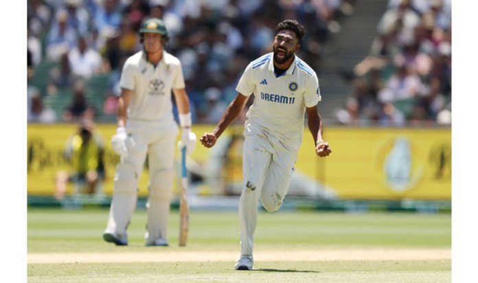 Mohammed Siraj celebrates after taking wicket of fourth cricket test match between Australia and India at Melbourne on Sunday. (UNI)
