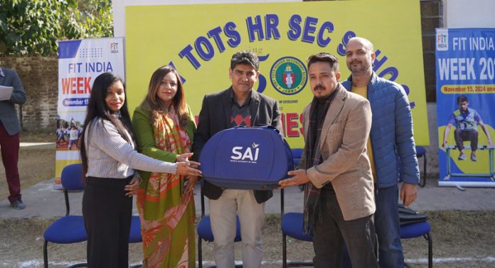 SAI representative presenting memento to school head. SAI representative presenting memento to school head.