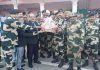 BSF officers greeting SBI officers during their visit at Octroi Post in Suchetgarh Border of Jammu on Thursday.