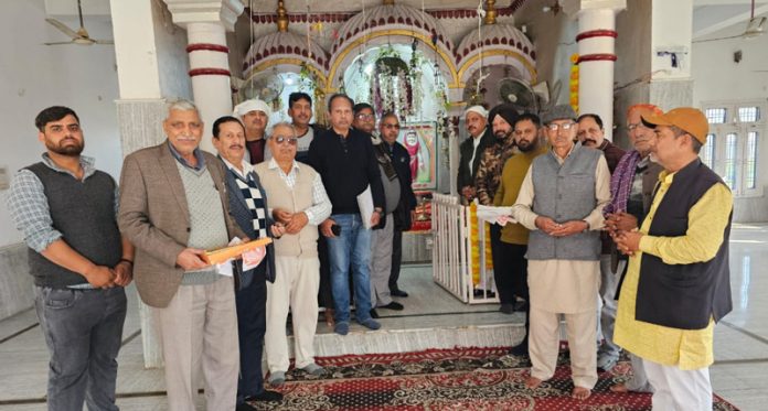 Members of Angurana Biradari posing with their new president in Jammu on Monday.
