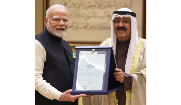 Prime Minister Narendra Modi receives Kuwait's highest honour 'The Order of Mubarak Al Kabeer' in Kuwait on Sunday. (UNI)