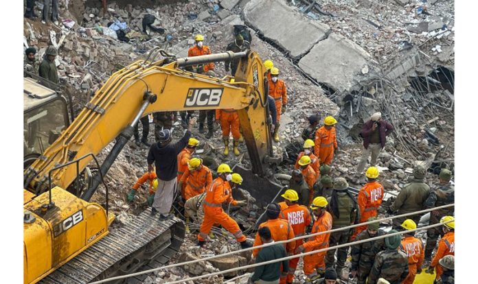 Rescue teams working at the site of multi-storey building collapsed in Mohali on Sunday.