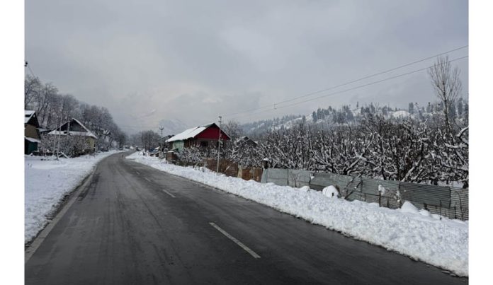 A view of snow-covered road in Heerpora area of Shopian following fresh snowfall on the Mughal Road. -Excelsior/Younis Khaliq