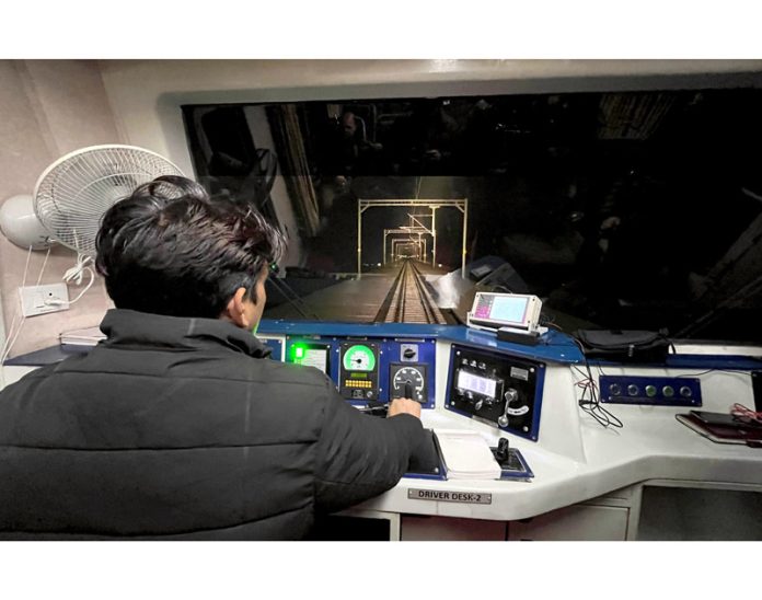 A locomotive engineer on job during the trial run on USBRL from Srinagar to Reasi district. - Excelsior/Shakeel