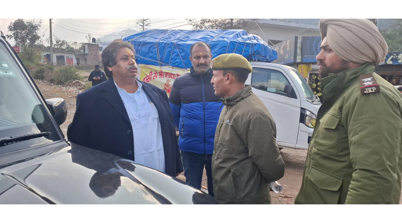 Congress UT president Raman Bhalla being stopped from marching towards Katra on the Jammu-Srinagar National Highway by police on Saturday.