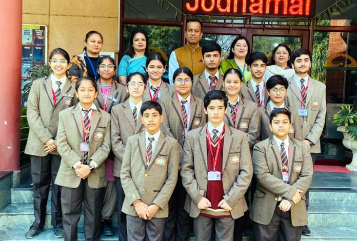 Swimmers of Jodhamal school posing along with management.