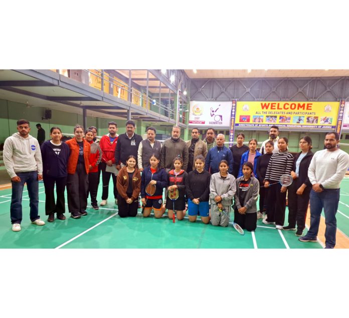 Badminton team posing along with dignutaries during Inter-Collegiate Badminton Championship at Jammu University.
