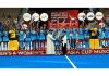 Junior Women’s Hockey team posing for group photograph along with trophy.